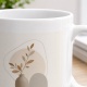 Tasse mit Vasenmotiv