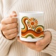 Tasse mit Retro-Sonnenmotiv