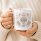 Tasse mit Blumenkranz und Vögeln
