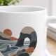 Tasse mit Küstenlandschaft