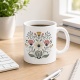Tasse mit Blumenillustration